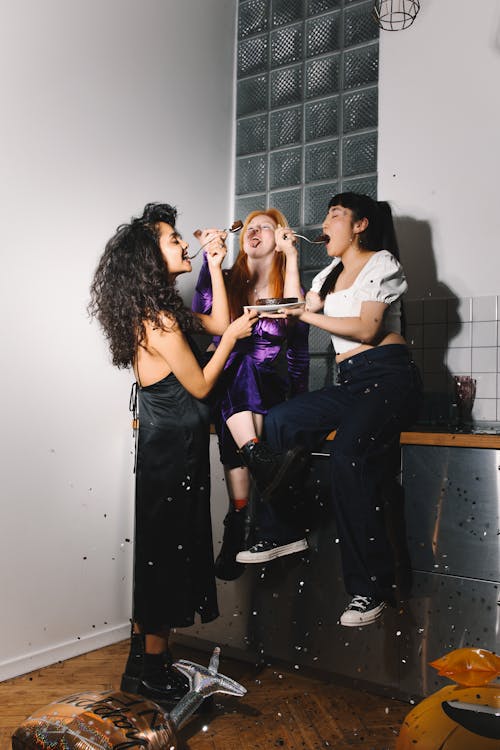 Women Sharing Chocolate Cake