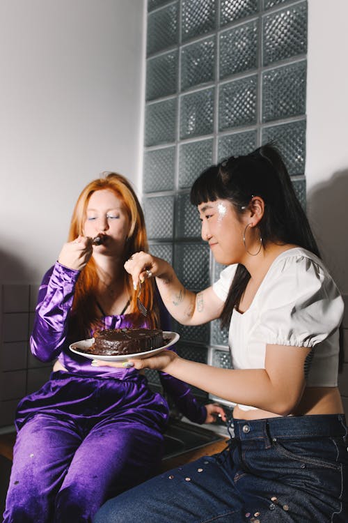 Women Eating a Chocolate Cake
