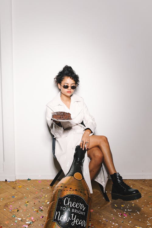 Woman in White Blazer Holding a Cake