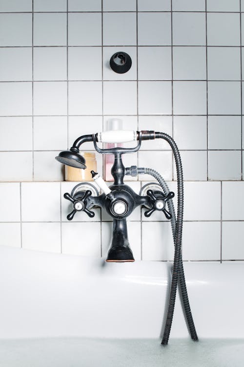 Free Black Faucet on White Wall Tiles Stock Photo