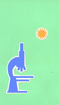 Creative design of decorative cardboard appliques of microscope under infectious agent on green background