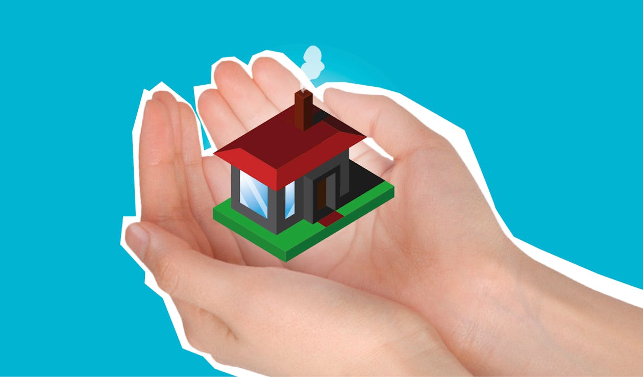 Cutout paper composition with house in handful showing concept of buying private apartment against blue background