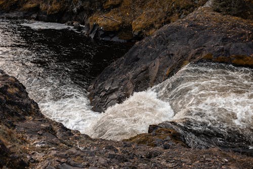Free Waterfalls on Brown Rocky Mountain Stock Photo