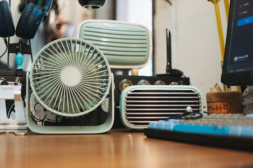 Antique Fan and a Radio on a Desk