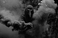 Person in Black and White Hoodie Smoking