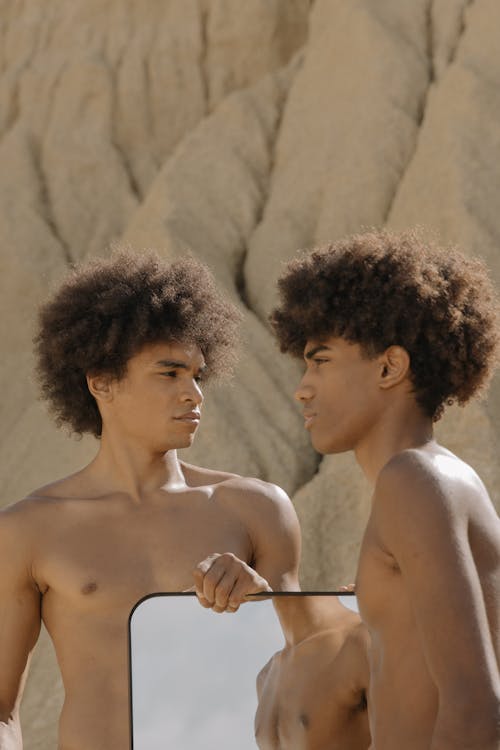 Free Shirtless Young men Holding a Mirror Stock Photo