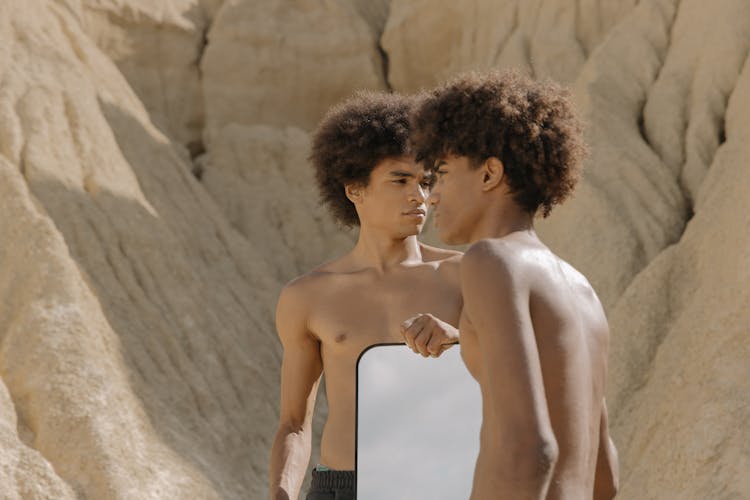 Shirtless Young Men Carrying A MIrror