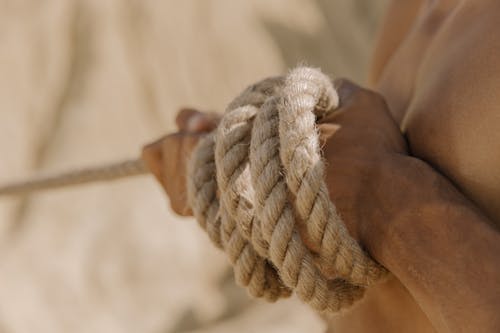 Person Holding Brown Rope