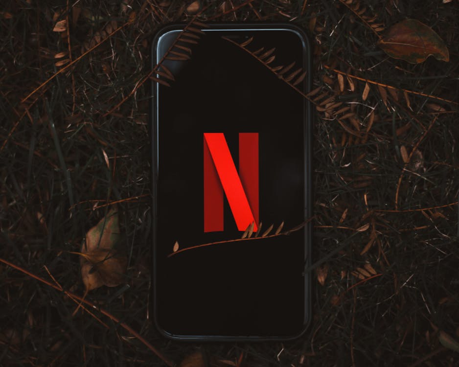 Drowning in digital subscriptions? New ExpressVPN survey reveals how it’s taking a toll 1 Free Netflix Logo on Smartphone Screen Stock Photo