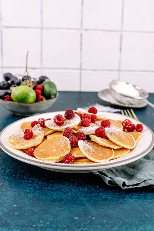 Free Pancakes with Fresh Raspberries on a Plate Stock Photo