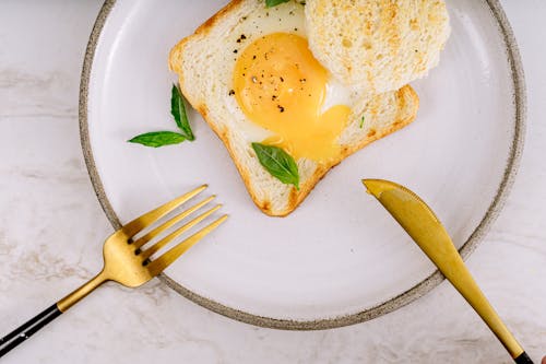 Toasted Bread with Egg on a Ceramic Plate 
