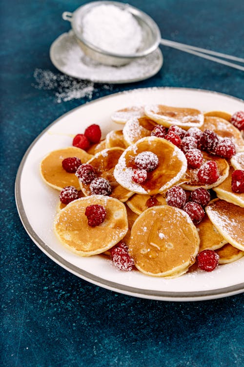 Free Pancakes with Fresh Raspberries on a Plate Stock Photo