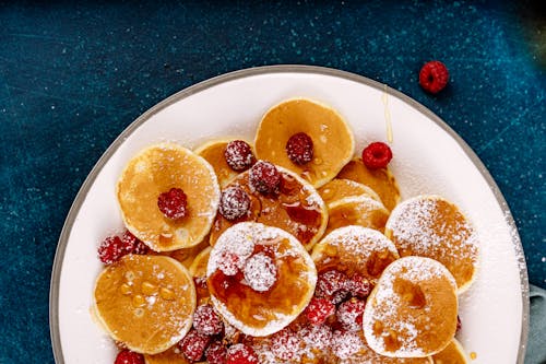 Free Pancakes with Fresh Raspberries on a Plate Stock Photo