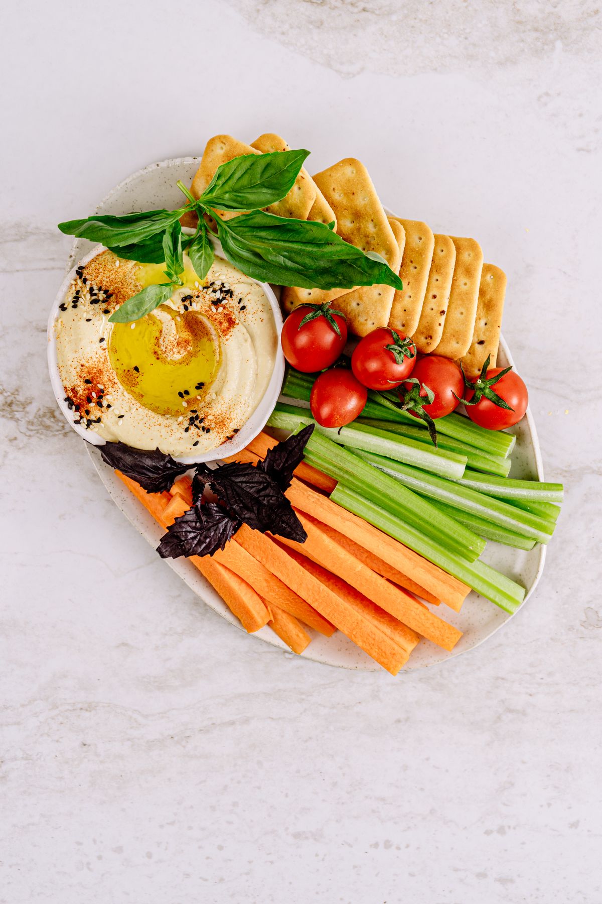 Fresh vegetables including carrots on a platter