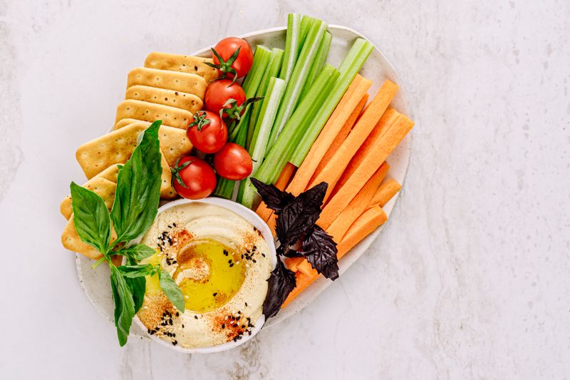 hummus vegetable wrap sliced in half