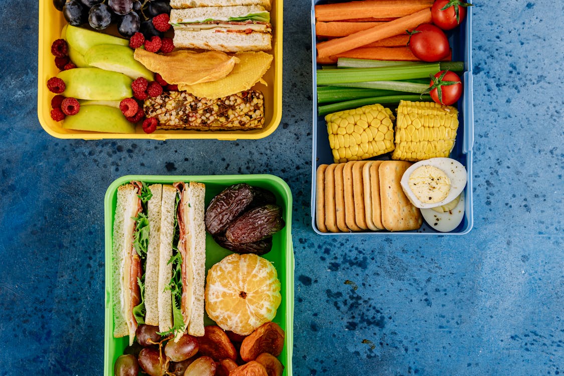 Healthy Lunch Boxes on the Blue Surface · Free Stock Photo