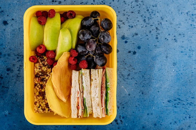 Lunch Box With Sandwiches And Fruit