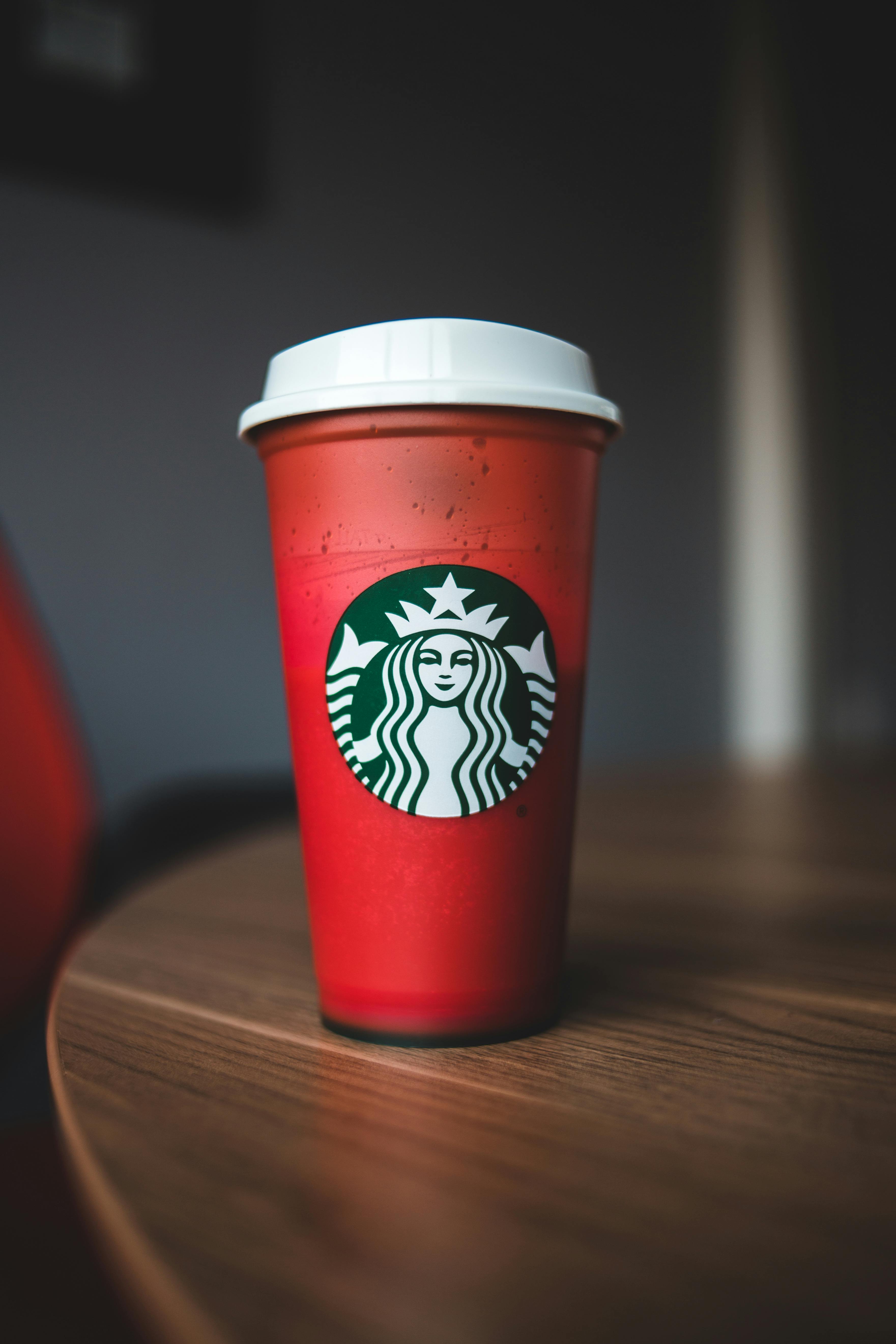 two red and green plastic cups on a table. AI-Generated 33457439 Stock  Photo at Vecteezy