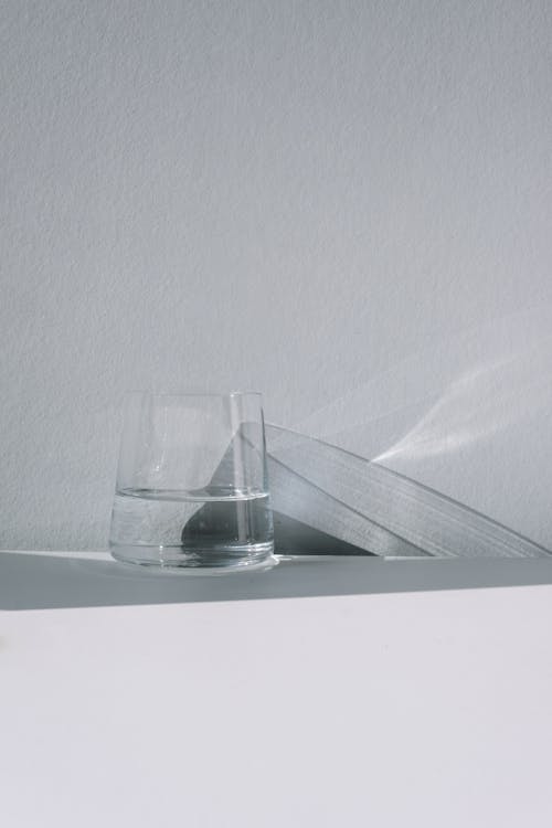 Free Clear Drinking Glass on White Table Stock Photo