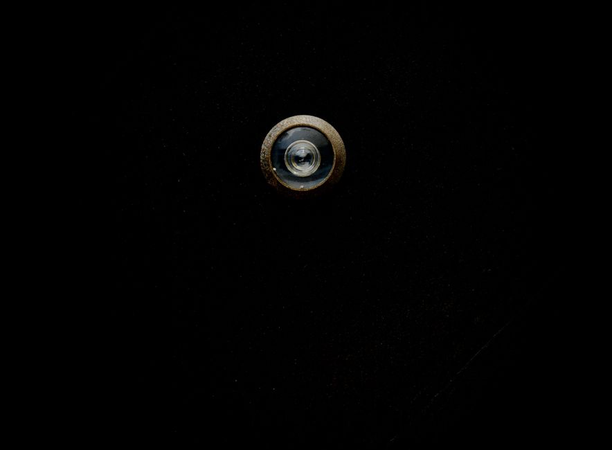 Beyond Backups: Advanced Ransomware Protection Strategies 5 - Beyond Backups,Advanced Ransomware Protection For Small Architecture Firms - - Bonelli Systems Close-Up Image Of A Metallic Door Peephole With A Black Background, Offering Copy Space.