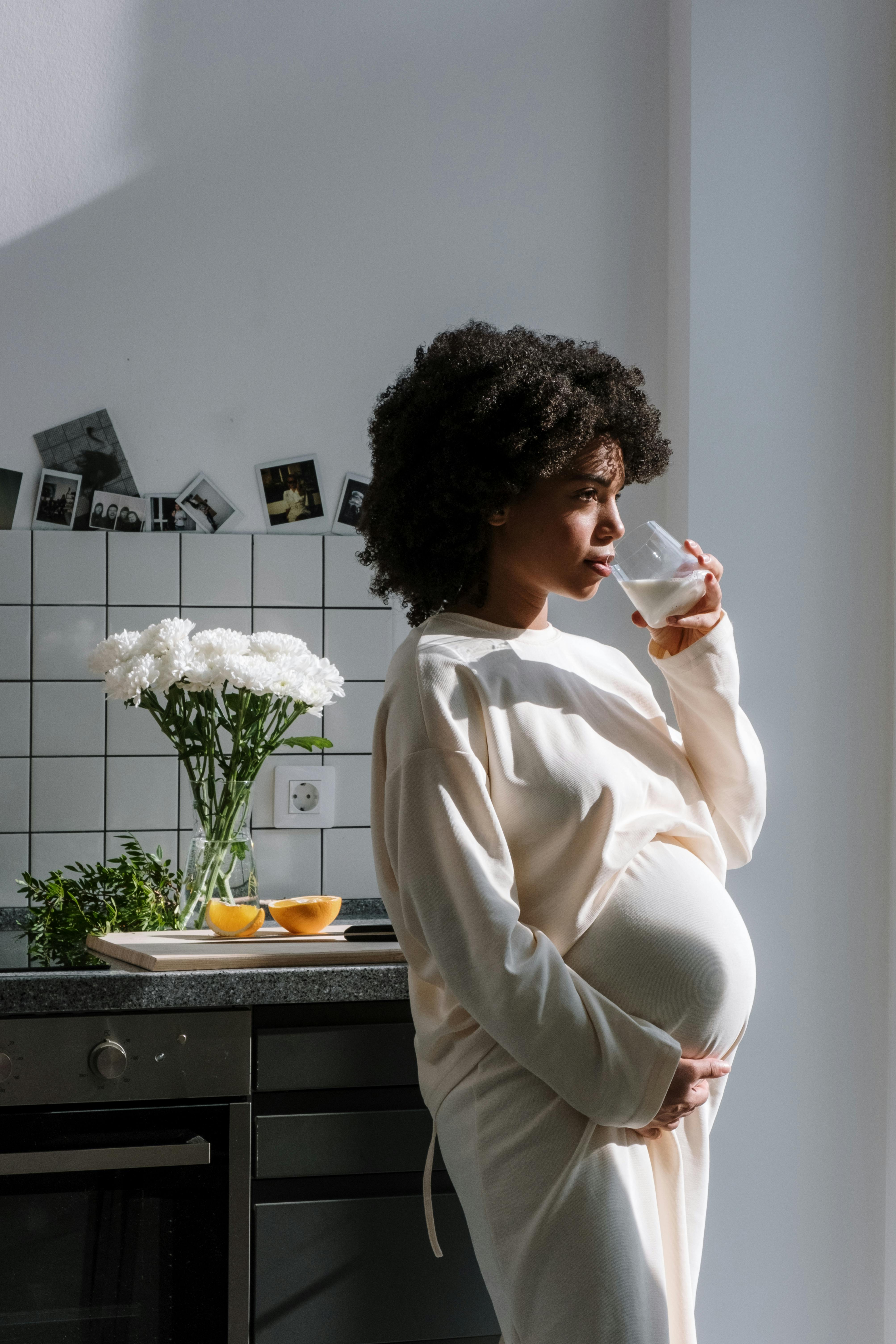 Free Pregnant Woman Drinking Milk Stock Photo