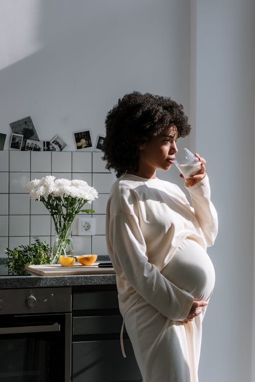 Free Pregnant Woman Drinking Milk Stock Photo