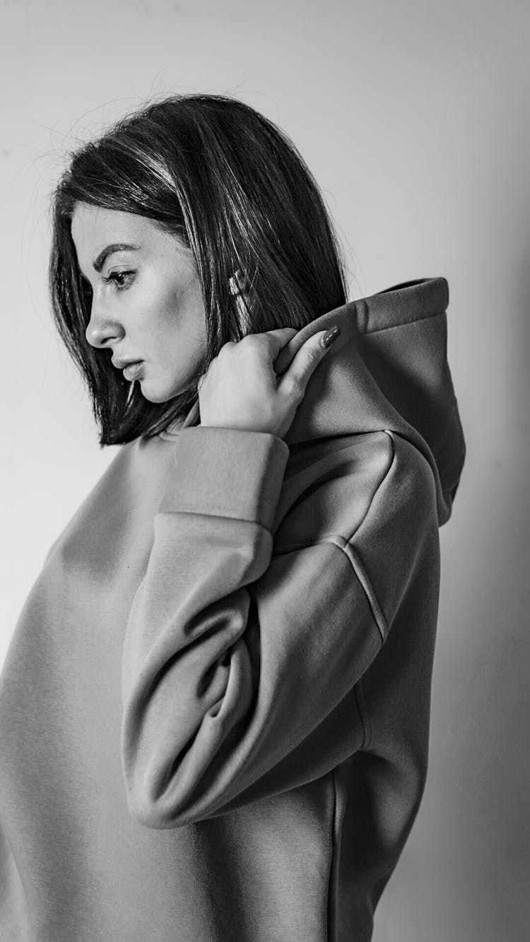 Black And White Portrait Of A Woman In A Hooded Sweatshirt