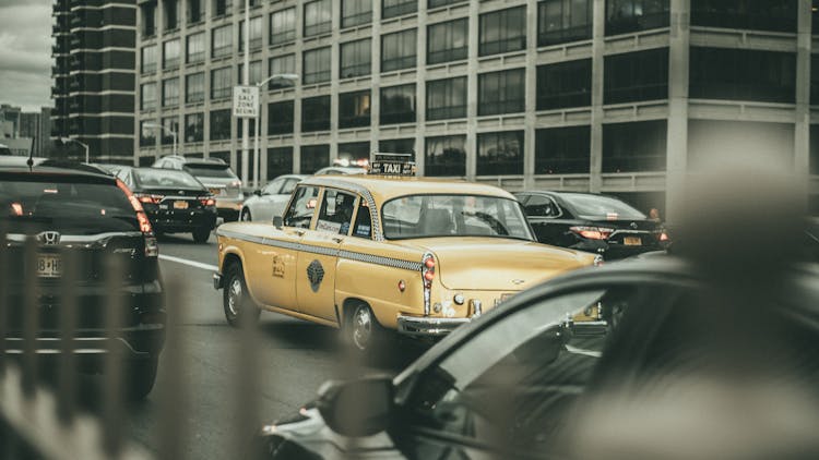 Yellow Taxi Cab On A Road