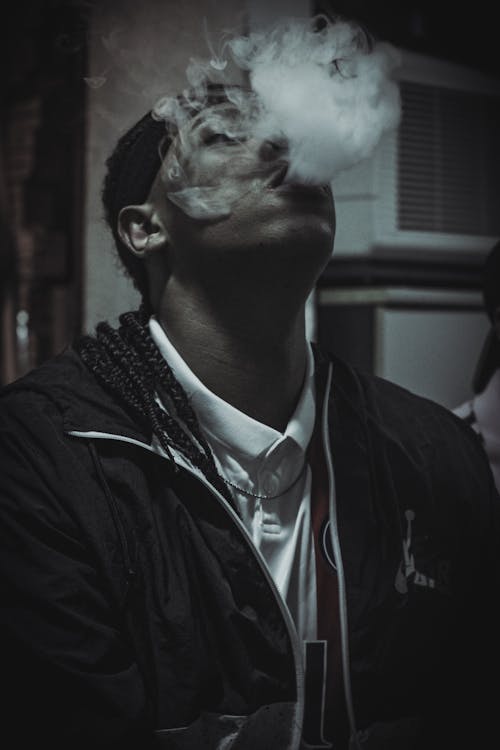 Free Monochrome Shot of a Man Smoking Stock Photo