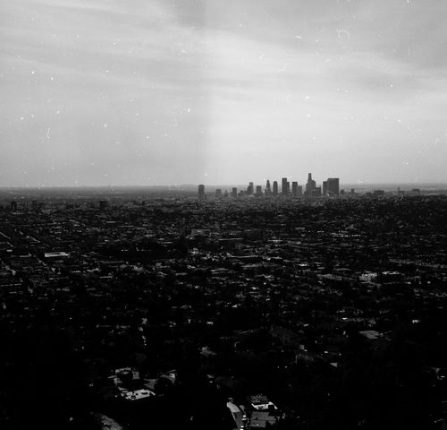 Free Monochrome aerial photo capturing the vast urban landscape and skyline of Los Angeles, California. Stock Photo