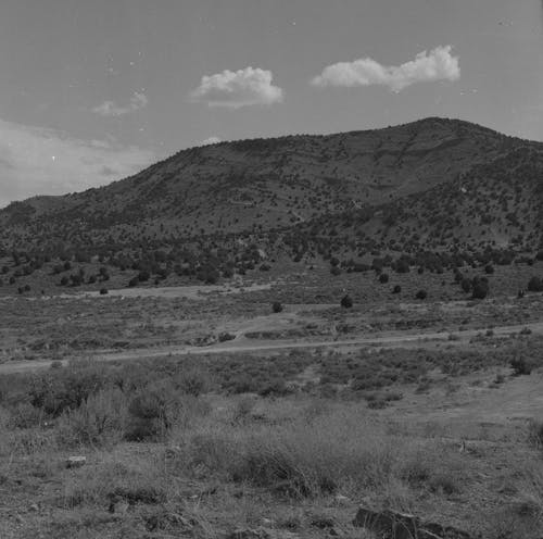 Grayscale Photo of Mountain Range