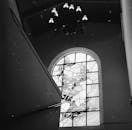 Grayscale Photo of a Stained Glass Window with Grills