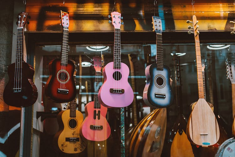 Colorful Guitars Hanging On The Stall 