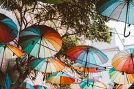 Assorted Umbrellas Hanging on Wire