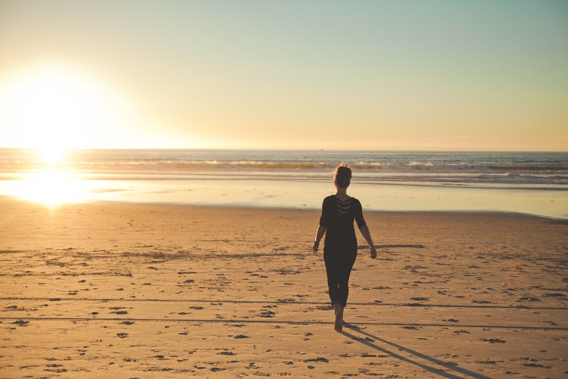 Free Person Walking on Beachshore Stock Photo