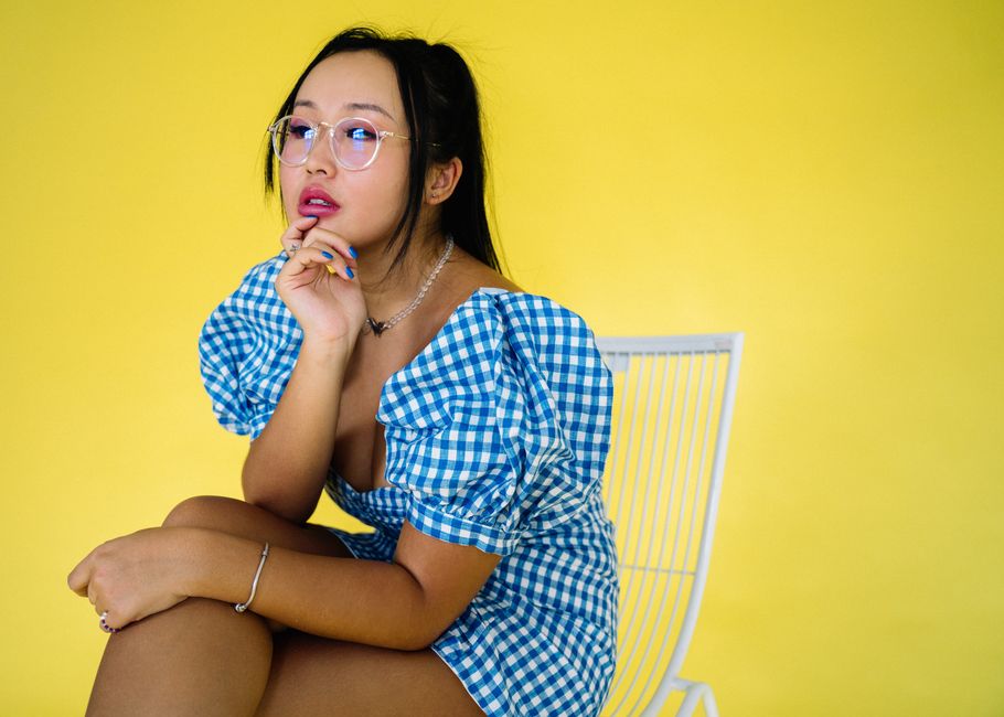 Woman in a blue gingham midi dress, picnic chic 4th of July styling