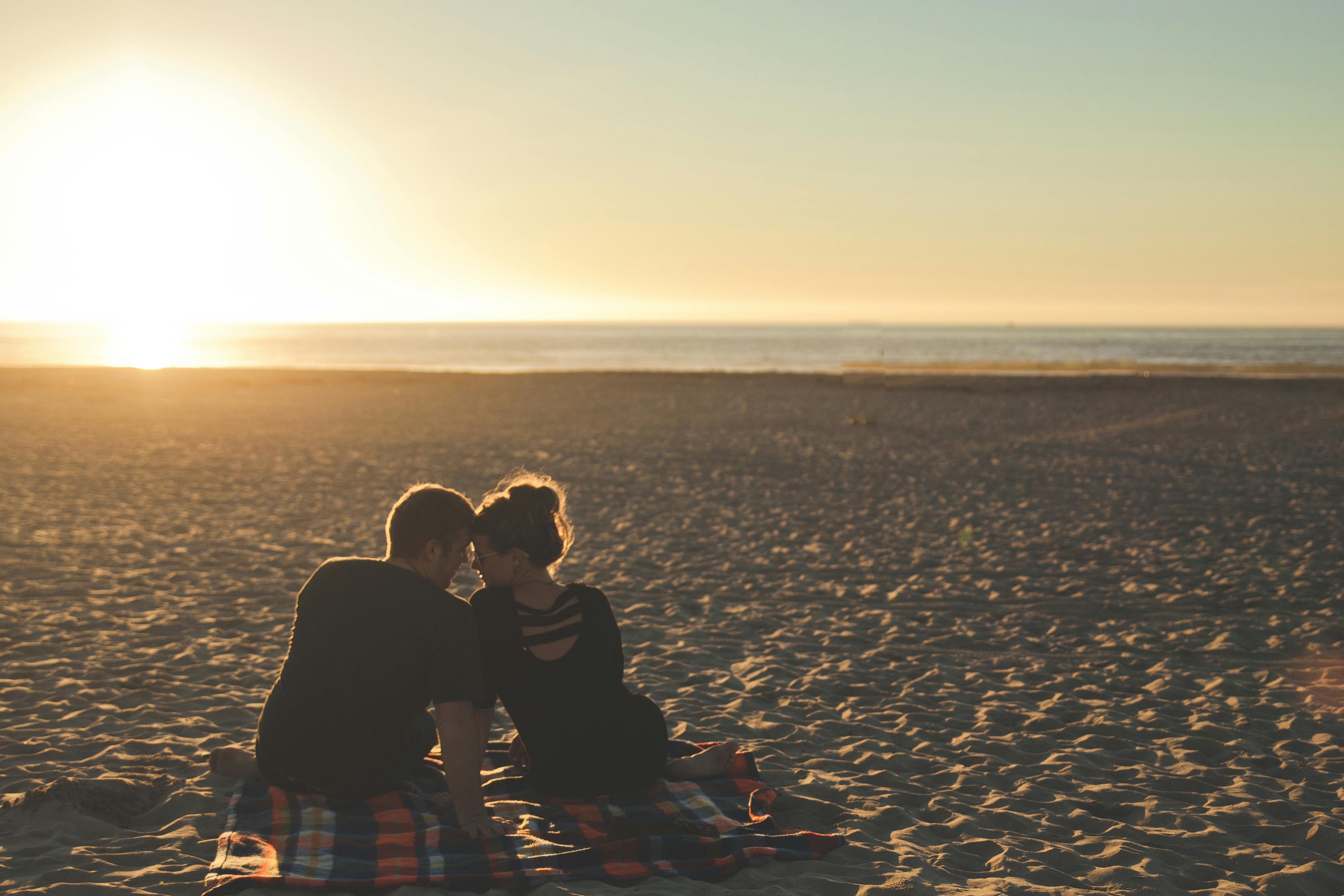 man and woman in front of horizon