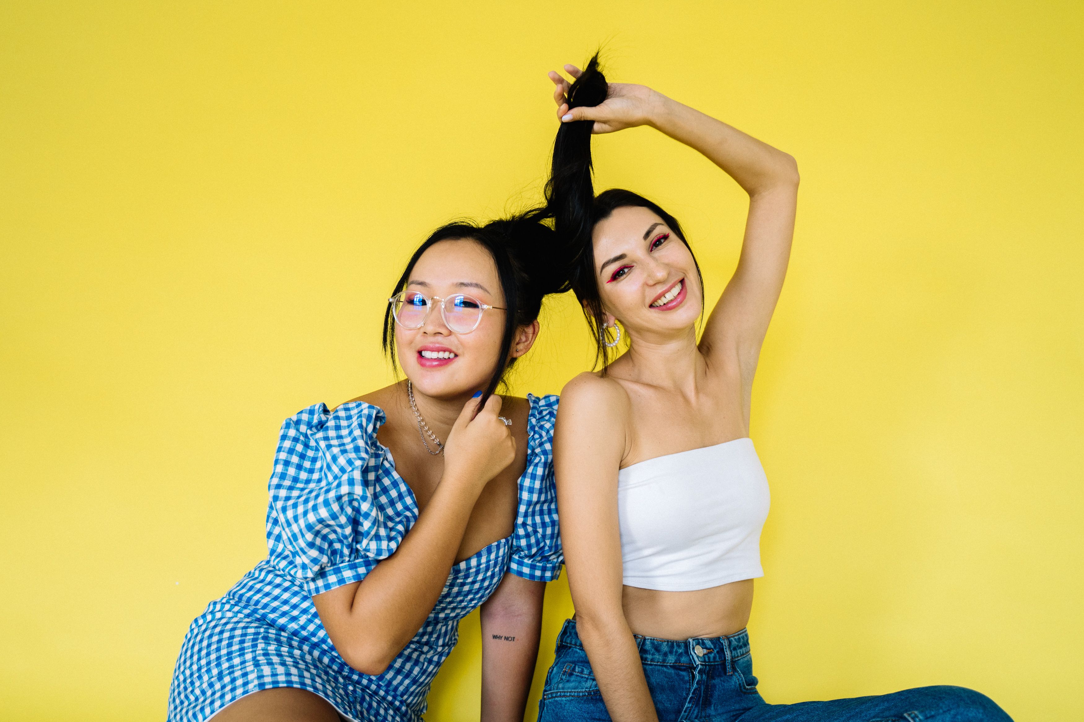 Woman Kissing Her Friends Cheek · Free Stock Photo