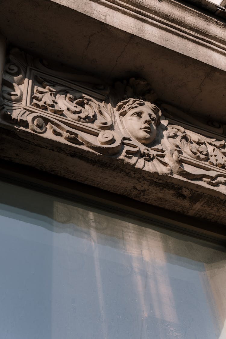 Low-Angle Shot Of An Intricate Carving On The Wall