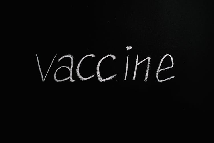 Vaccine Lettering Text On Black Background