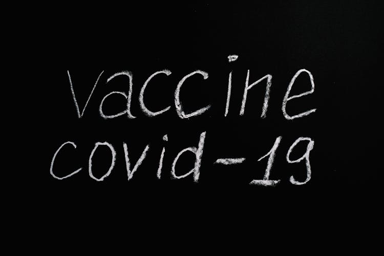 Vaccine Covid-19 Lettering Text On Black Background