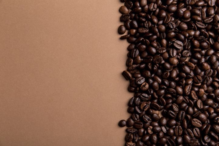 Dak Lak Vietnamese coffee beans on a wooden surface