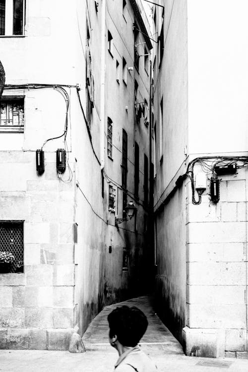 Grayscale Photo of a Narrow Alley