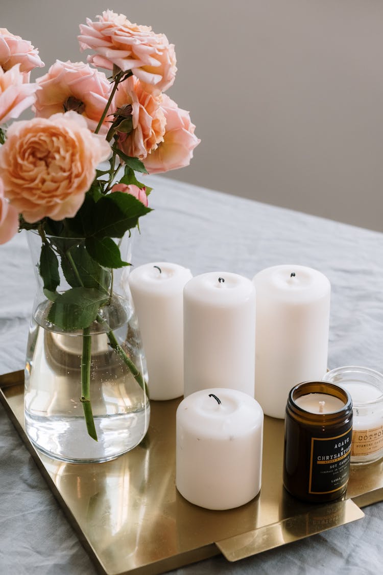 White Candles And Vase Of Flowers