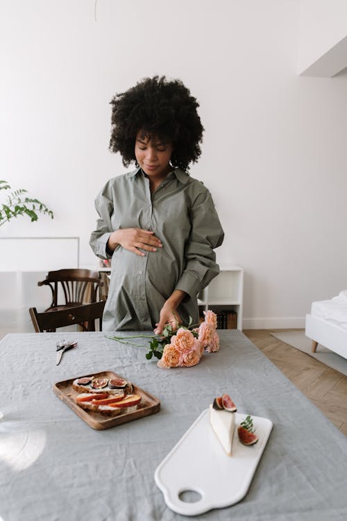 A Pregnant Woman in Gray Long Sleeves Shirt