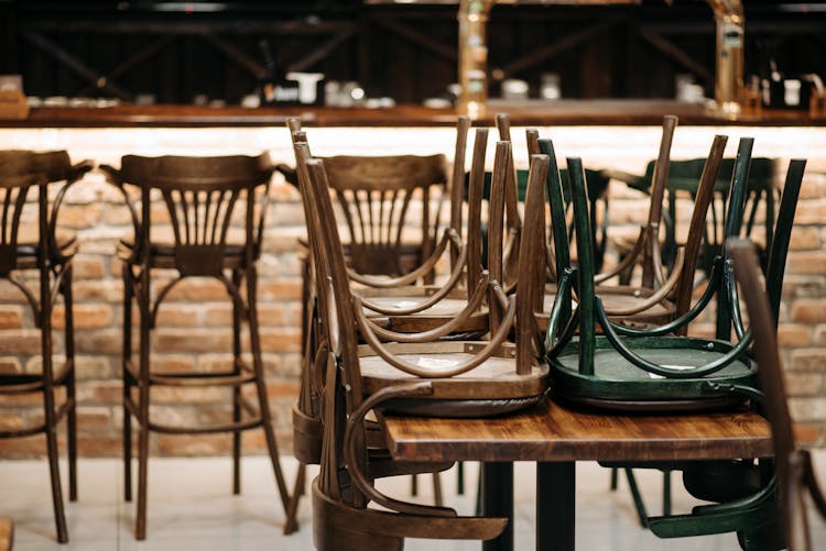 Brown Wooden Chairs On Table