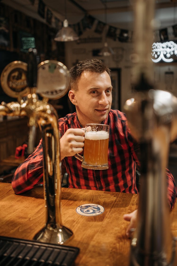 Man In Black And Red Plaid Shirt Drinking Beer