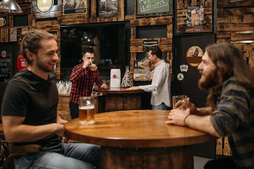 A People Drinking Beer in the Bar