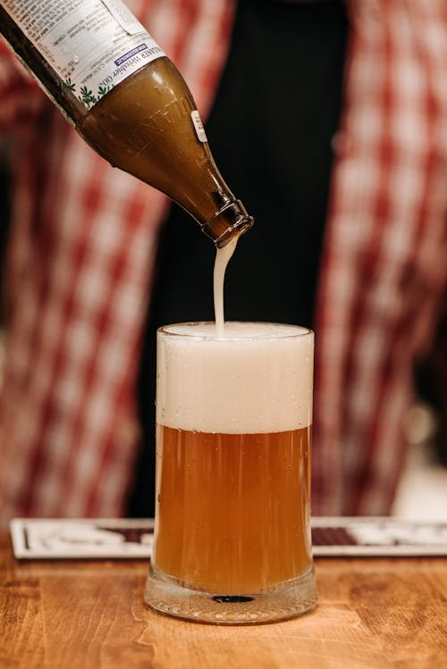 Beer Bottle on Top of a Beer Glass