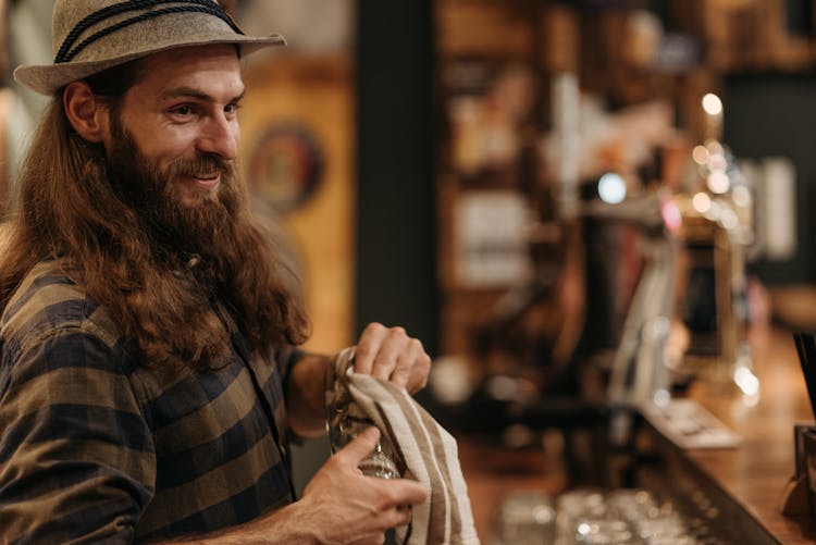 Bearded Man Cleaning A Glass